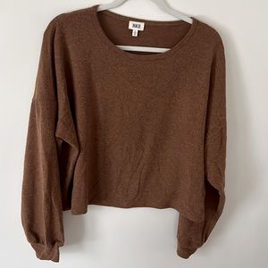 Never worn. Cropped soft long sleeve shirt. Runs bigger